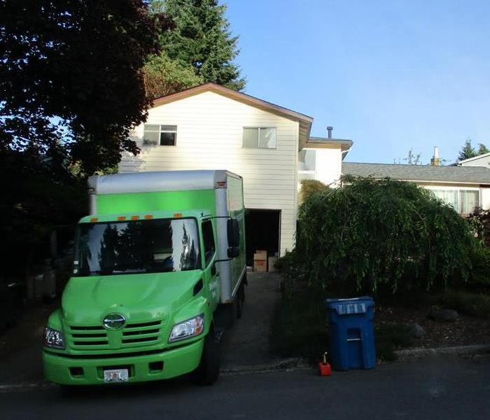 SERVPRO truck parked in a driveway