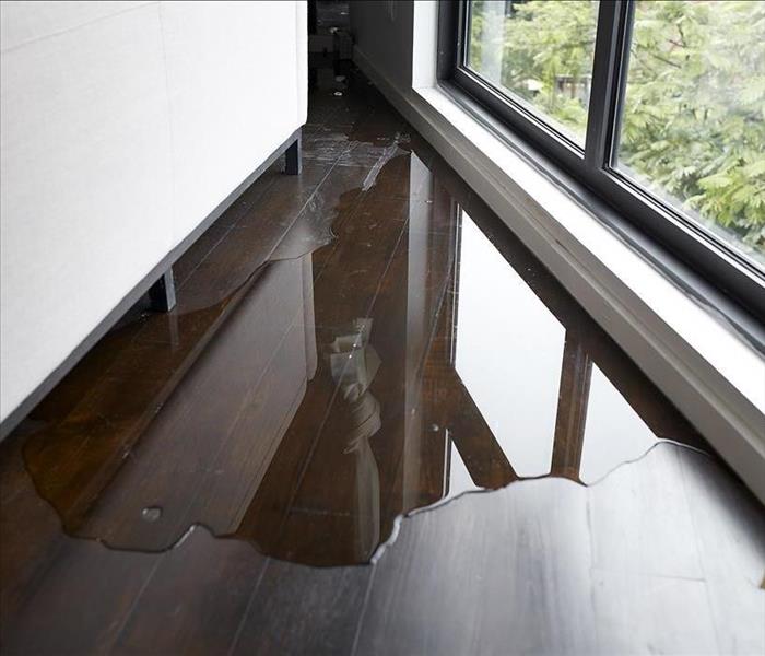 water leaking onto hardwood floor