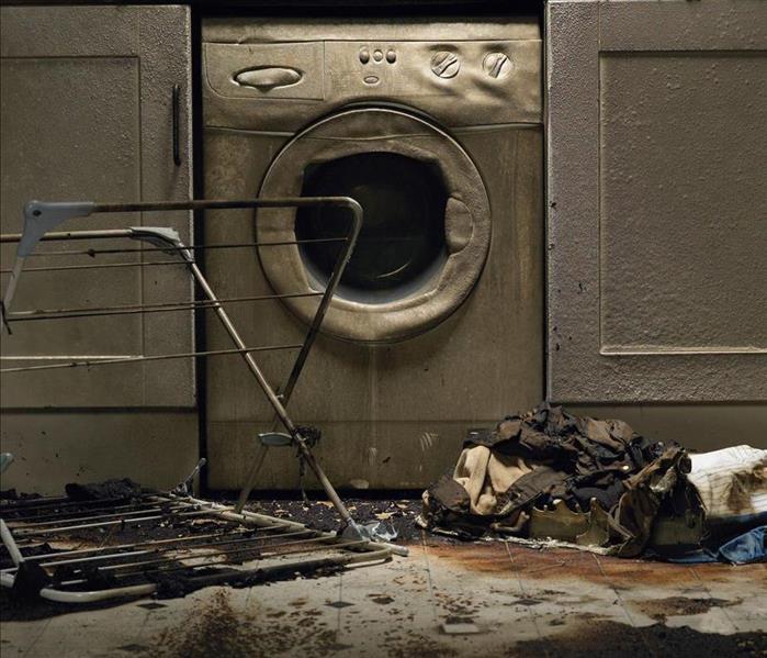 fire damaged laundry room and washer